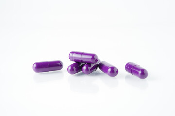 Pile of medical capsule pills, supplement vitamin, isolated over the white background