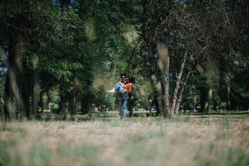 Couple enjoying a playful moment in a serene park surrounded by trees. Lush greenery and love in the air, showcasing happiness and togetherness.
