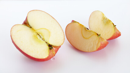 Cut red Fuji apples oozing with juicy juice