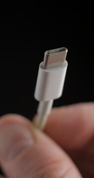 USB-C connexion cable macro rotating slow motion, vertical view