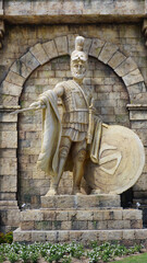 Warrior rome greek. Warrior wearing iron helmet and warrior old metal shield. Ancient warrior isolated