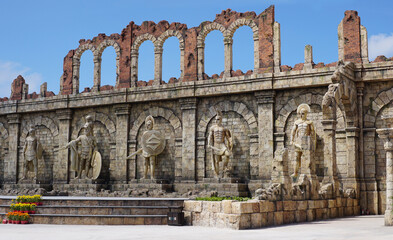 Greek Roman warriors and restored Roman walls tourist landscape. Warrior rome greek.