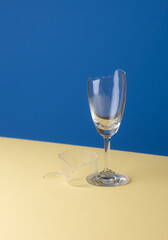 Broken wine glass on a blue backgroun, Broken dishes