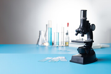 Microscope biology and chemistry subject on the desk