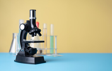 Microscope biology and chemistry subject on the desk