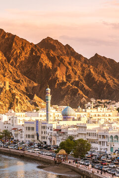 Oman, Muscat. Cityscape of Mutrah old town at sunset