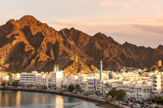 Old town at sunset with mountains in the background, Mutrah, Muscat, Oman