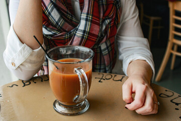 person sitting at table with coffee
