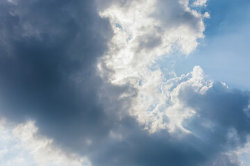 Sunlight shining through dark clouds