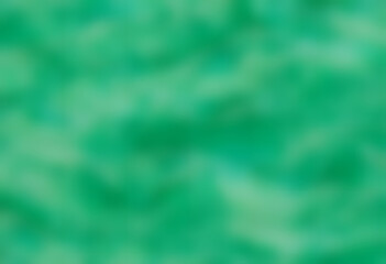 Obraz premium An abstract pattern of green waves resembling water surface, with a textured appearance a vibrant green color with a marbled effect, resembling jade. The light creates movement in the design.