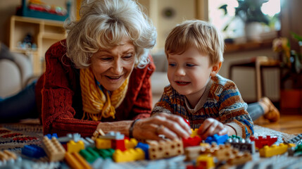 Grandmother and grandson lying on carpet playing with building blocks