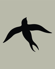 silhouette of a swallow flying freely