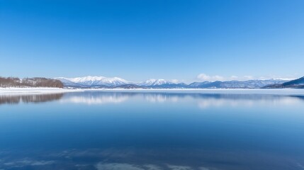 The lake on a clear winter day with fresh blue sky mirror lake surface and snowy mountains in the distance Lake Kussharo in Hokkaido Japan : Generative AI