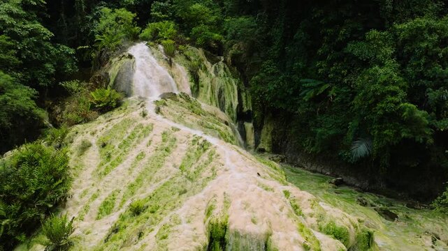 Beautiful Bilawa Mainit Hot Spring in the rainforest. Falls in the tropical mountain jungle. Davao de Oro, Philippines.