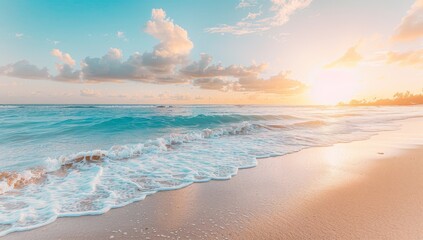 Obraz premium Tranquil Blue Waves Meeting a Sandy Shore at Sunset