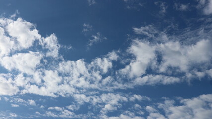 bright blue sky background with white clouds