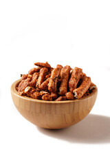 A bowl of Basreng (fried meatballs), a popular Indonesian snack made from thinly sliced fish meatballs, fried until crispy, and coated with spicy seasoning. Photographed against a white background.