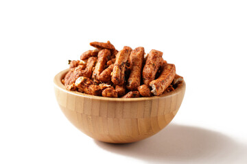A bowl of Basreng (fried meatballs), a popular Indonesian snack made from thinly sliced fish meatballs, fried until crispy, and coated with spicy seasoning. Photographed against a white background.
