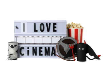 PNG, Reel, lightbox with text, popcorn and paper Halloween figurines, isolated on white background