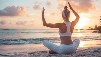 Woman practicing yoga on beach at sunset