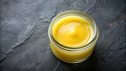Ghee butter in a clear glass jar from a top view, ghee, butter, dairy, glass jar, top view, organic, food