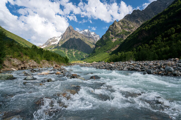 View of the Dombay-Ulgen gorge in the mountains of the North Caucasus near the village of Dombay on...
