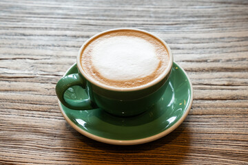cup of coffee on wooden table