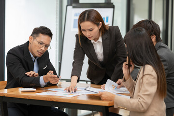 Asian Business Group Chat about graph work Present in meetings, in the office