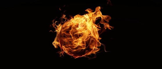 Fototapeta premium Fiery orange orb ablaze against a black background.