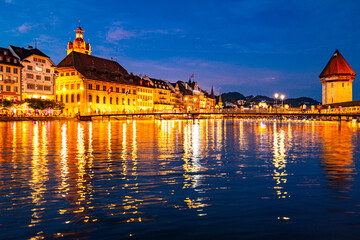 Lucern city with famous Chapel Bridge. Lucerne city view. Canton of Lucerne. Lucern Switzerland. Sunrise in historic city center of Lucerne with famous Chapel Bridge and lake Lucerne.