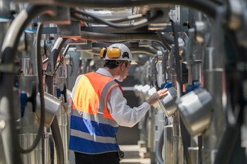 Engineers inspect gas and water pipes for power and cooling in industrial and building systems....