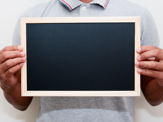 A man holding a blackboard.