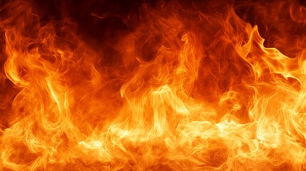 Fototapeta premium Bright and intense fire flames in vibrant colors visible.