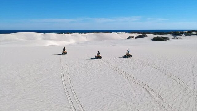 Quad in desert sand lancelin dune horizon 4k drone