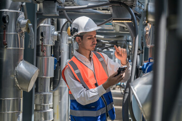 Engineers inspect gas and water pipes for power and cooling in industrial and building systems....