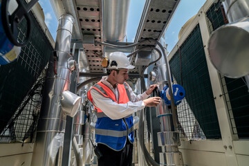 Engineers inspect gas and water pipes for power and cooling in industrial and building systems....