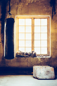 Basic Workout - A heavy boxing bag in raw industrial gym