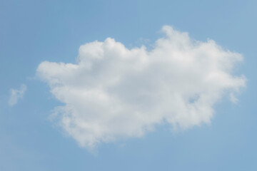 Lonely white cloud on the blue summer sky