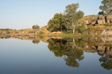 The calm water faithfully reflects the surrounding landscape.