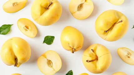A selection of quince, both whole and sliced, arranged with precision. The rich golden hues stand out against the pure white background