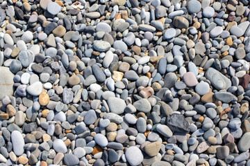 Background texture of sea pebbles, round small stones.