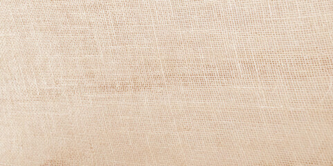 Close-up of fabric woven from burlap. Hessian sackcloth burlap woven texture background with copy space for text decoration.