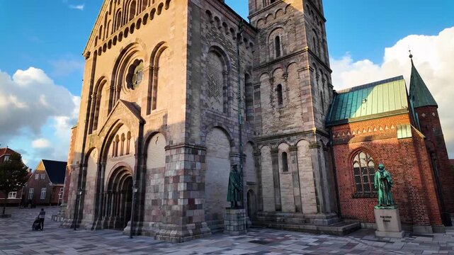 Camera shows Ribe Cathedral Square  tilt up to reveal the Ribe Cathedral with its impressive towers. Ribe Cathedral Church in Ribe Denmarks oldest town.