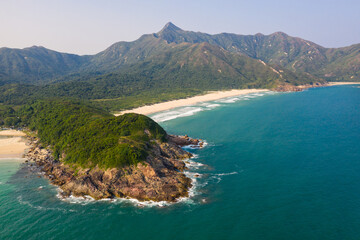 Hong Kong: Dramatic landscape of the Sai Kung peninsula with sandy beaches and the Sharp peak in...