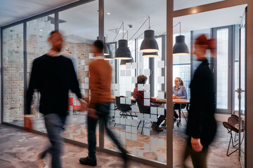 In the dynamic hustle and bustle of a business environment, a group of young business professionals...
