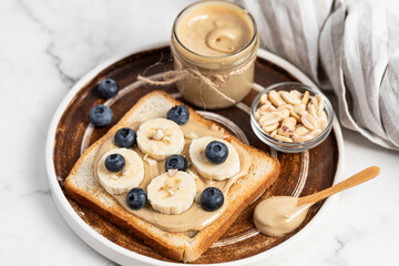 peanut butter banana toast topped with berries, American breakfast