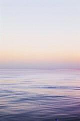 Obraz premium Abstract background wallpaper, gradients,purple and pink, tranquil ocean landscape blending soft purple and pink hues, reflecting a peaceful twilight sky in a dreamy and ethereal water