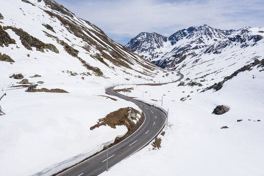 Aerial view of the Fl&uuml;ela moutain pass covered with snow in late winter between Davos and Susch in the alps in Canton Graub&uuml;nden in Switzerland