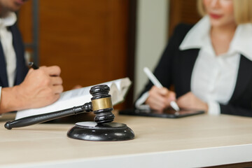 judge on wooden table And experienced lawyers meet with clients and give advice behind the scenes. legal services legal consulting concept