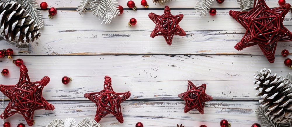 Poster a festive christmas scene featuring red rattan stars cones and a white wooden backdrop ideal for a g